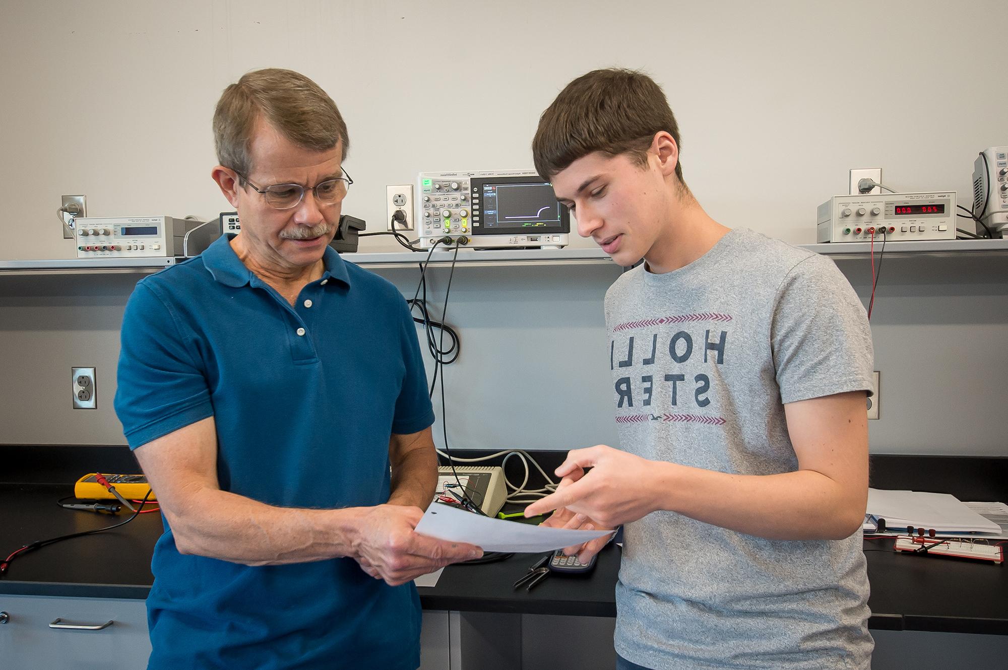 Engineering student and his instructor.